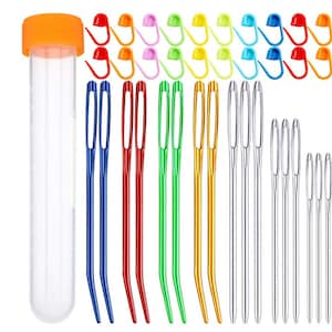 May include: A set of 20 colourful plastic yarn needles and 6 metal needles in a clear plastic tube with an orange lid. The needles are assorted sizes and colours, including blue, red, green, yellow, and silver.