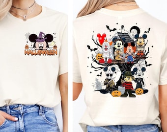 May include: A white t-shirt with a Mickey Mouse Halloween design on the front and a Halloween-themed Mickey Mouse and horror character design on the back. The shirt is being worn by a person with blue jeans.