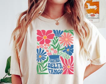 さりげないフォックストロット・デルタ・タンゴ・フローラルシャツ、ファック・トランプ・フラワーTシャツ、フローラル・プログレッシブ・グラフィックTシャツ、民主党ボヘミアンFDT隠されたメッセージシャツ