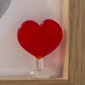 May include: A set of three ceramic mugs with a speckled, matte finish in cream, light grey, and dark grey. Each mug has a simple, minimalist design, ideal for coffee or tea.