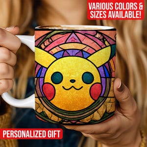 May include: White ceramic mug with a stained-glass style Pikachu design. The design features yellow, red, blue, and orange colours. Text on the mug reads "PERSONALIZED GIFT" and "VARIOUS COLORS & SIZES AVAILABLE!"