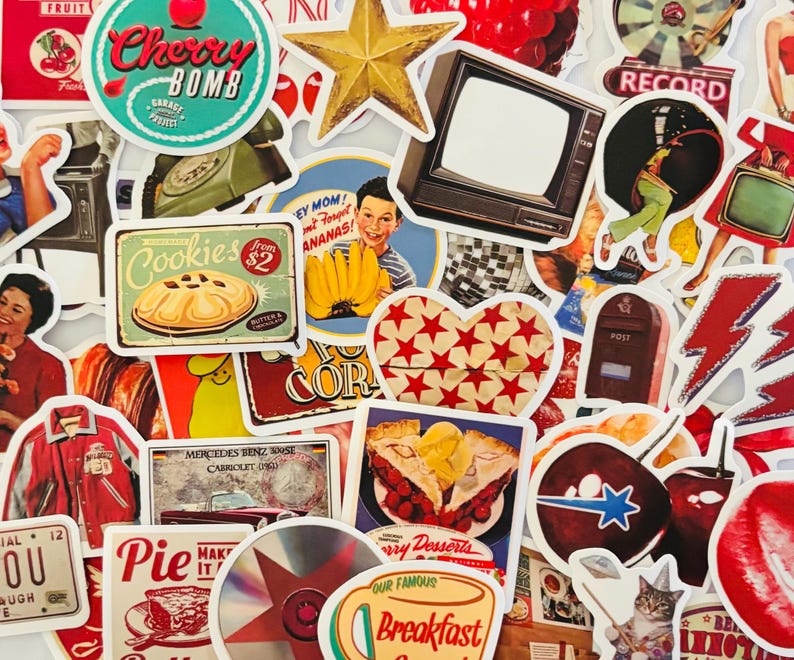 May include: A collection of assorted vintage-style stickers featuring diverse graphics including a Cherry Bomb logo, a retro television, a cookie advertisement, a heart with red stars, a red varsity jacket, a cat, and various food and drink illustrations.