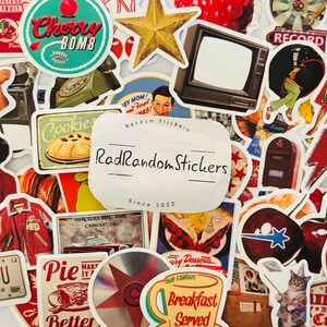 May include: A collection of assorted stickers featuring retro-style illustrations including a cherry bomb logo, a vintage television, a red lightning bolt, a cat, various food items, and a central white label with the text RadRandomStickers Since 2022.