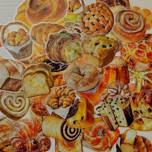 May include: A collection of assorted bakery stickers featuring illustrations of golden-brown croissants in a basket, a lattice-top pie, a cinnamon roll, a pepperoni pizza, sliced bread, a bagel, a waffle, and various other pastries and breads.