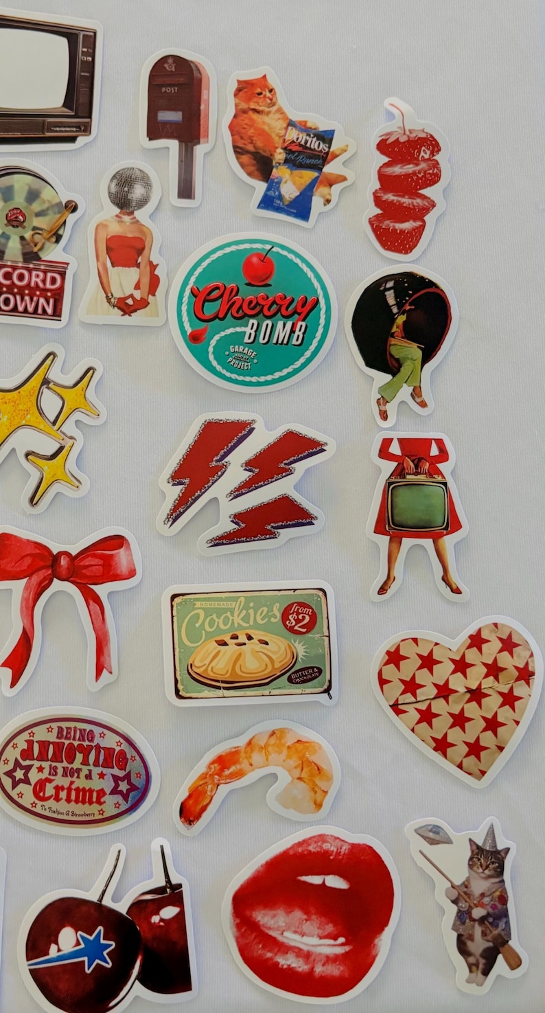 May include: A collection of assorted die-cut stickers featuring various illustrations including a vintage television, a mailbox, a cat eating chips, sliced strawberries, a cherry bomb logo, a red bow, a cookie sign, and a pair of red lips.