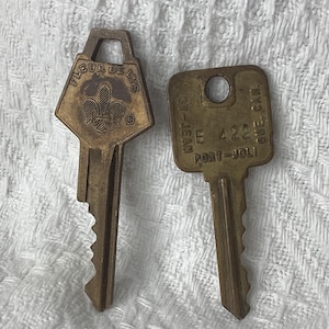 vintage Fleur De Lys and Quebec village brass keys, set of 2, collectable unique shaped, Canadian