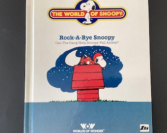 World of Snoopy Rock a Bye book, vintage 1986 Hard cover Peanuts gang