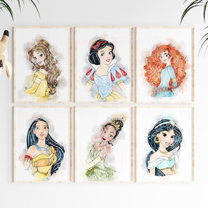 May include: Set of six watercolor-style prints featuring Disney princesses. Each print features a different princess, including Belle, Snow White, Merida, Pocahontas, Tiana, and Jasmine. The prints are framed in a simple white frame.