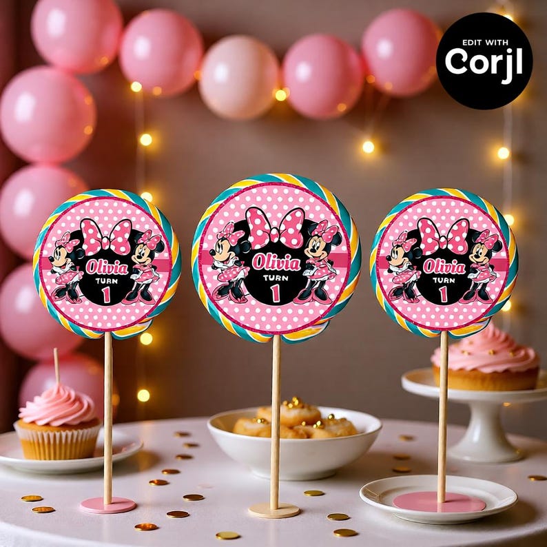 May include: Three pink and white Minnie Mouse-themed lollipop decorations. Each lollipop features a pink polka dot background, Minnie Mouse illustrations, and the name "Olivia" with the number "1". The lollipops are on wooden sticks.
