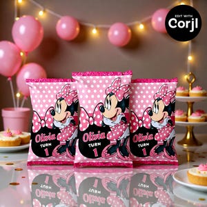 May include: Three pink polka-dot party favor bags featuring Minnie Mouse, with the name "Olivia" and the number "1" printed on them. The bags are decorated with a pink border and are set on a reflective surface.