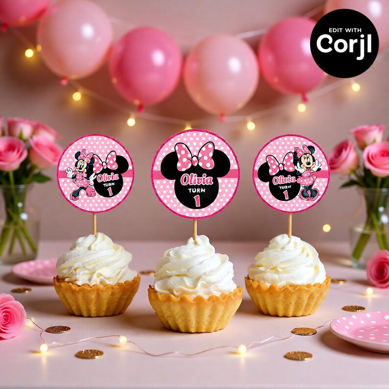 May include: Three cupcakes with white frosting and Minnie Mouse-themed toppers. The toppers are pink and black with the name "Olivia" and the number "1". Pink balloons and roses decorate the background.