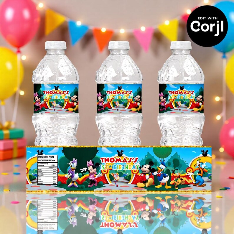 May include: Three clear plastic water bottles with labels featuring Mickey Mouse and friends, with the text "THOMAS'S 1ST BIRTHDAY". The bottles are arranged in front of a banner with the same theme, with colorful balloons and party decorations in the background.