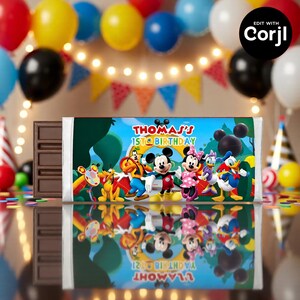 May include: A chocolate bar with a custom wrapper featuring Mickey Mouse, Minnie Mouse, Donald Duck, and other Disney characters. The wrapper has the text "Thomas's 1st Birthday" in blue and red. The background includes a blue sky and green trees.