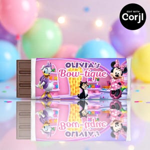 May include: A chocolate bar with a custom wrapper featuring Daisy Duck, Minnie Mouse, and a black cat. The wrapper reads "Olivia's Bow-tique" in pink and purple, with a pink background and cartoon decorations.