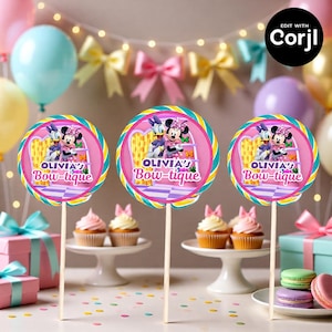 May include: Three round lollipop decorations on wooden sticks, featuring Minnie Mouse and Daisy Duck. The lollipops have a pink and purple design with the text "OLIVIA'S Bow-tique". The background includes cupcakes, balloons, and gifts.