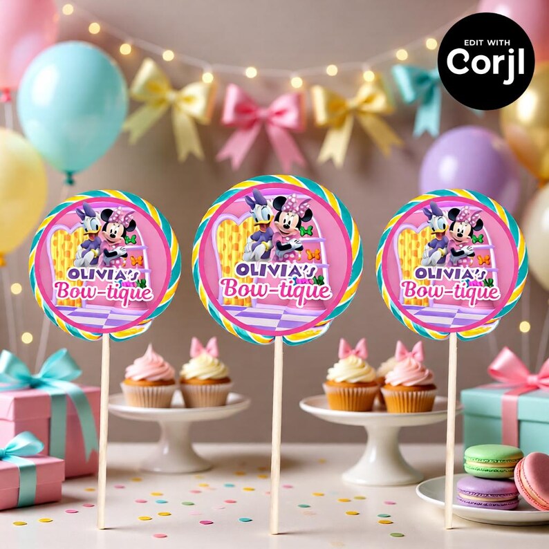 May include: Three round lollipop decorations on wooden sticks, featuring Minnie Mouse and Daisy Duck. The lollipops have a pink and purple design with the text "OLIVIA'S Bow-tique". The background includes cupcakes, balloons, and gifts.