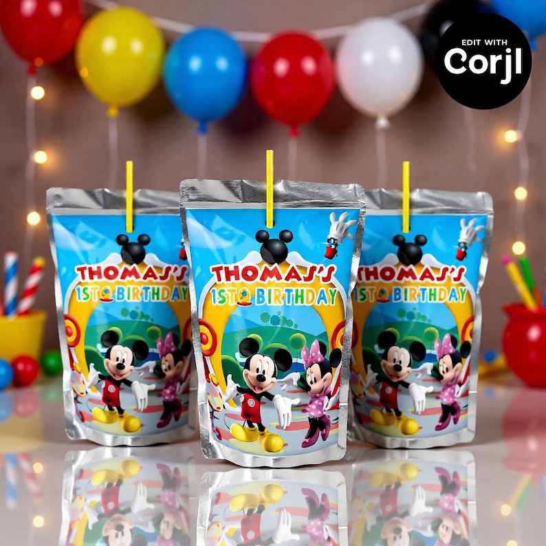May include: Three juice pouches with yellow straws, featuring Mickey and Minnie Mouse. The pouches are labeled "THOMAS' 1ST BIRTHDAY" with a colorful design. Balloons in red, yellow, blue, and white are in the background.