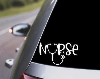 May include: White vinyl decal with the word "NURSE" and a stethoscope graphic. The decal is on the back window of a silver car.