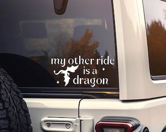 May include: White vinyl decal with a silhouette of a dragon and the text "my other ride is a dragon".