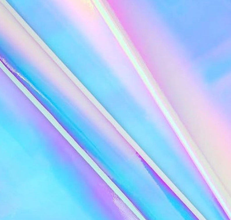 May include: Abstract iridescent background with blue, purple, and pink hues. The colors shift and change depending on the angle of light.