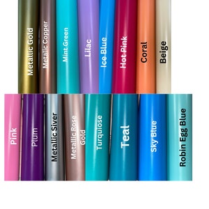 May include: A color chart showing 18 different colors of vinyl. The colors are arranged in two rows of nine. The colors are: Pink, Plum, Metallic Silver, Metallic Rose, Gold, Turquoise, Teal, Sky Blue, Robin Egg Blue, Metallic Gold, Metallic Copper, Mint Green, Lilac, Ice Blue, Hot Pink, Coral, and Beige.