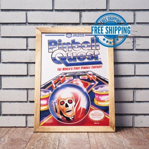 May include: A framed poster for the Nintendo video game "Pinball Quest" by Jaleco. The poster features a colourful illustration of a pinball machine with a skull-like character in the centre.