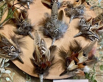 Pheasant feather hat pins and brooches