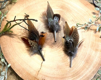Pheasant feather hat pins and brooches