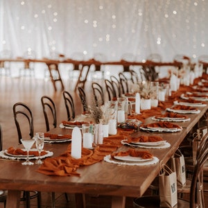 These gorgeous rust rustic table runners will add a beautiful, airy texture to your wedding table decor. This rust table runner is one of the most popular used for wedding, events and dinner settings.