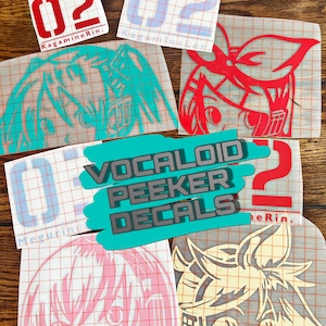 May include: A collection of vinyl decals featuring anime-style character designs. The decals include images of characters in various colors, along with the text "VOCALOID PEEKER DECALS" and the number "02".