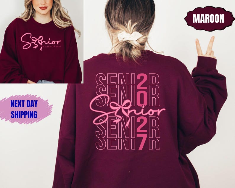 May include: Maroon sweatshirt with the word "Senior" in a cursive font, with "Class of 2023" below it. The back of the sweatshirt has the word "Senior" repeated vertically with a bow graphic. The sweatshirt is a dark red color.