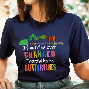 May include: A navy blue t-shirt featuring a colourful caterpillar graphic and the text "If nothing ever CHANGED There'd be no BUTTERFLIES".
