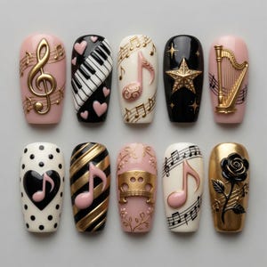 May include: A set of ten artificial nails with musical themes. Designs include a gold treble clef, piano keys, musical notes, a star, a harp, a heart with a musical note, gold and black stripes, a gold musical instrument, and a black rose.
