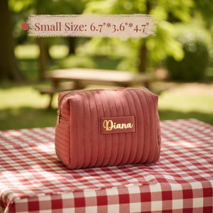 a small pink purse sitting on top of a table