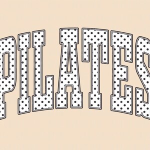 May include: The word "PILATES" in a bold, arched font. The letters are white with black polka dots, outlined in black, and set against a light tan background. The design has a vintage, athletic aesthetic.