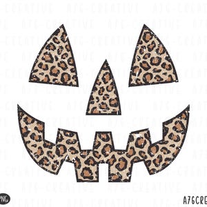 May include: A digital illustration of a jack-o'-lantern face with a leopard print pattern. The design features triangular eyes, a triangular nose, and a jagged mouth. The design has a distressed, vintage look. The text "A76CREATIVE" is at the bottom.