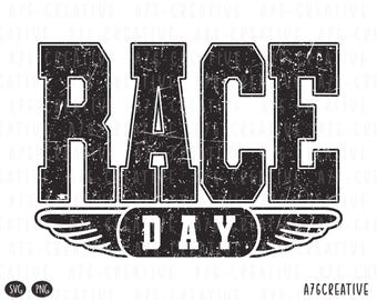 May include: Black and white graphic design with the words "RACE DAY" in a bold, distressed font. The text is above a banner with wings. The design has a vintage, worn look, suitable for apparel or event promotion.