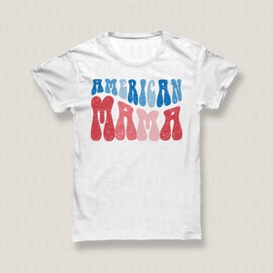 May include: White t-shirt with the text "AMERICAN MAMA" in red, blue, and pink retro font.