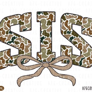 May include: A graphic design featuring the word "SIS" in a camouflage pattern, with a bow at the bottom. The letters are in shades of brown, green, and tan, with a distressed texture. The bow is a solid tan color.