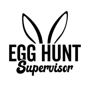 May include: Black and white graphic with bunny ears above the words "EGG HUNT SUPERVISOR". The text is in a bold, sans-serif font, with the word "Supervisor" in a cursive font. The image is on a white background.