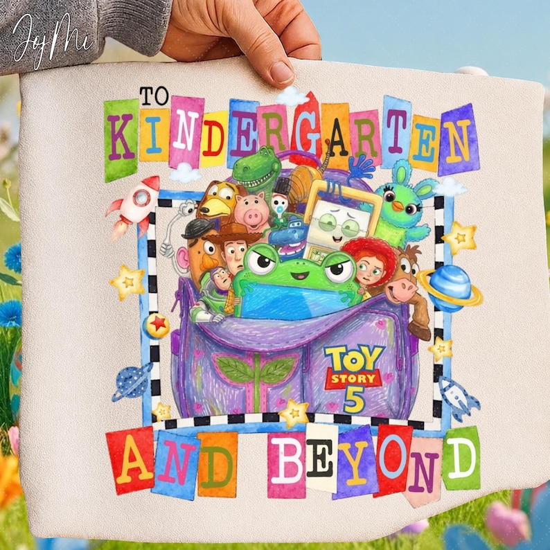May include: A beige fabric bag featuring a colorful graphic of Toy Story characters inside a purple backpack. The text reads TO KINDERGARTEN AND BEYOND with the Toy Story 5 logo. The design includes rockets, planets, and stars in a vibrant cartoon style.