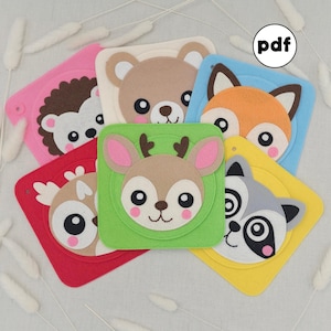 May include: A selection of colourful felt animal-themed squares, featuring a hedgehog, bear, fox, raccoon, and deer. Each square has a different animal face with large eyes and a contrasting border. The word "pdf" is in a white circle.