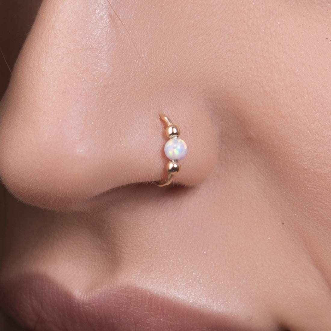 Phone quality] New nostril piercing, rose gold + opal! Pierced at Maria  Tash in NYC. : r/piercing