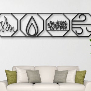 May include: Black metal wall decor with four octagonal shapes, each featuring a different element: fire, water, earth, and air. The decor is mounted on a white wall above a white couch with green throw pillows.