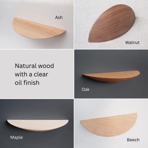 May include: A collection of wooden shelves in various wood types, including ash, walnut, oak, maple, and beech. Each shelf has a clear oil finish. The shelves are in a half-moon shape.