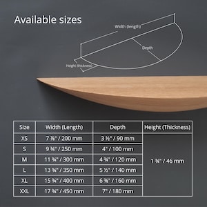 May include: A wooden floating shelf with a curved front edge. The image includes a size chart with measurements in inches and millimeters, detailing width, depth, and height for various sizes, from XS to XXL. The text "Available sizes" is at the top.