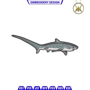 May include: Embroidered design of a blue and white thresher shark with a long tail. The shark is swimming to the right.