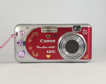 Y2K camera Canon Powershot A430 in red color