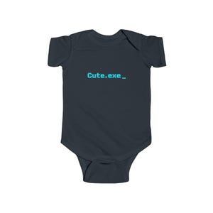 May include: A dark charcoal gray short-sleeve baby bodysuit featuring the text "Cute.exe_" printed in a bright cyan pixelated font across the chest. The garment has a round neckline and a snap closure at the bottom for easy access.