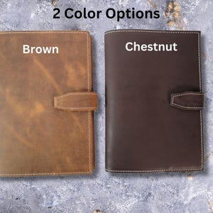 May include: Two leather-bound journals, one brown and one chestnut, with the words "Brown" and "Chestnut" printed on the front covers.  2 Color Options.